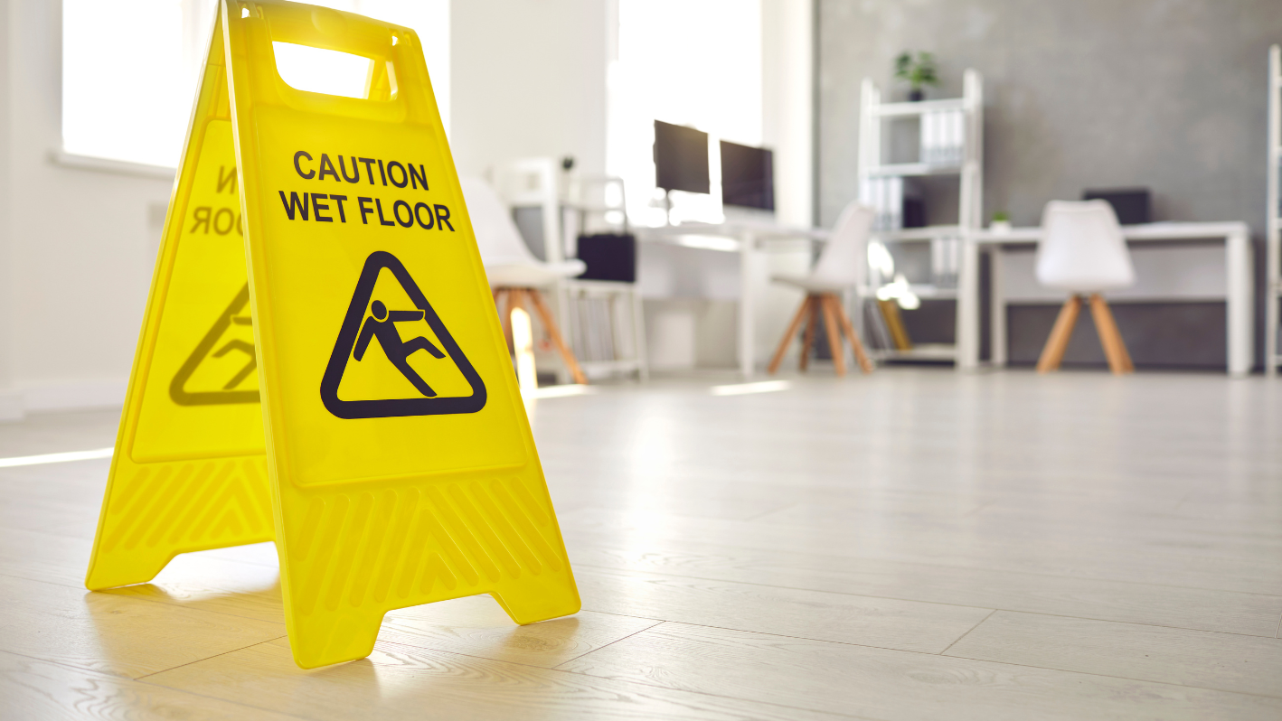 A caution wet floor sign on the floor